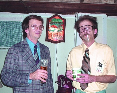 Halloween: "Funeral director" and "mad scientist" -- with Heileman's Beer sign. 